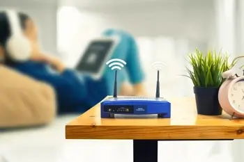 Router with WiFi signal rests on table at home