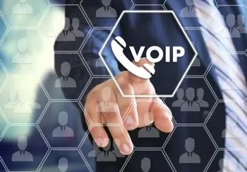 Hand reaching out to press VoIP button