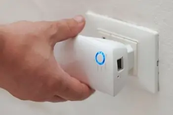 WiFi extender plugged into outlet