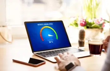 A laptop displays fast Internet loading speeds
